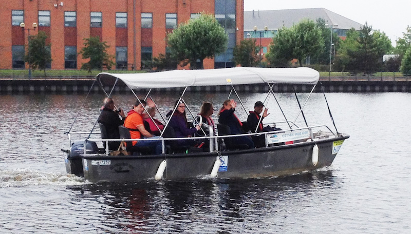 Tees Wheelyboats volunteers with passengers on the river